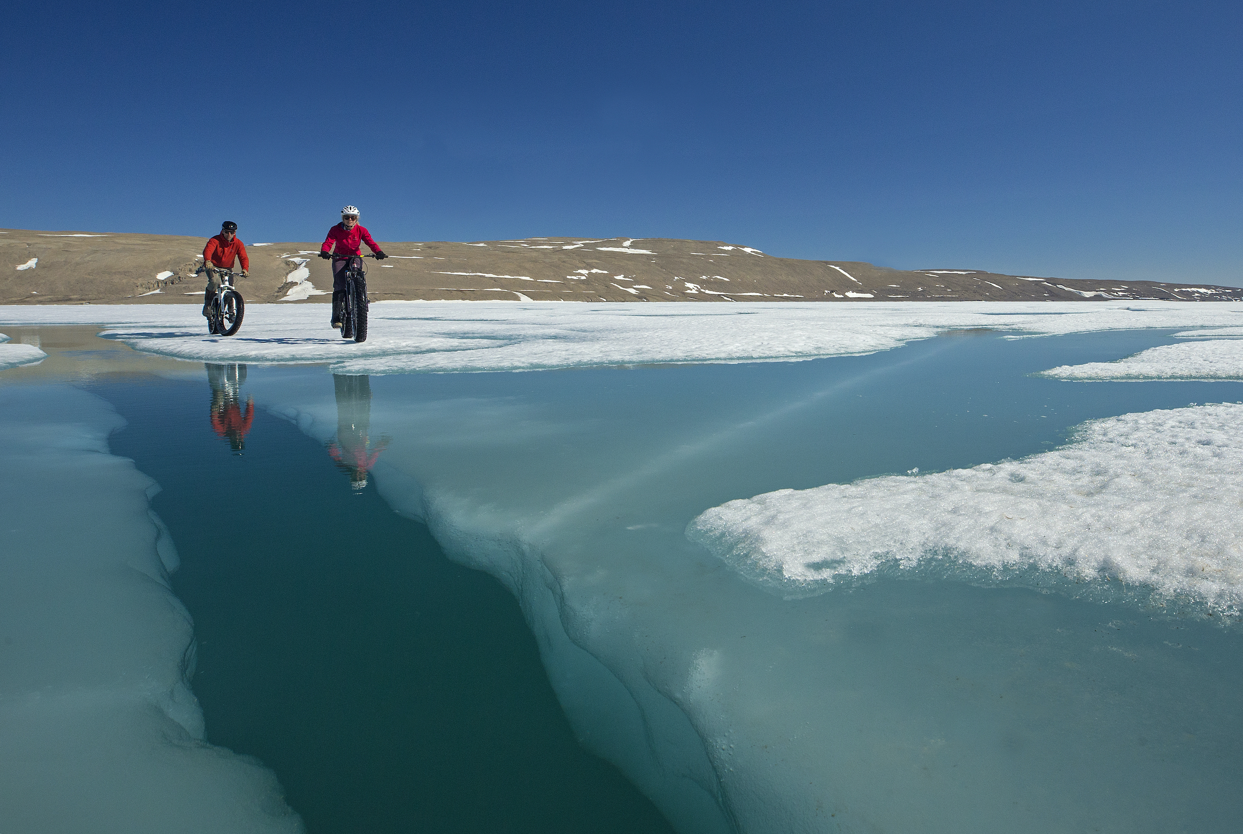 Arctic Biking on the Northwest Passage ice near Arctic Watch Wilderness Lodge
