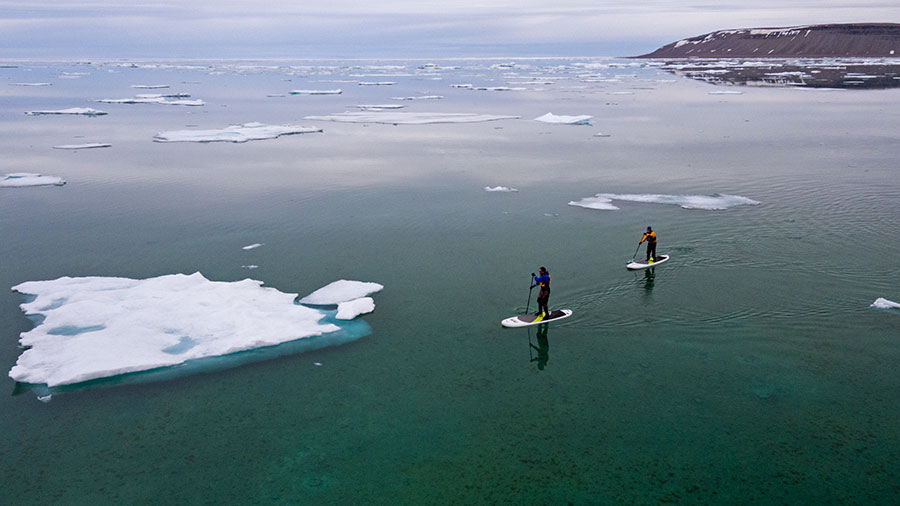 Paddle boarding on the Northwest Passage near Arctic Watch